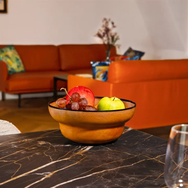 Elegant fruit presentation: a single-tiered mendoravy wooden bowl adorned with horn.