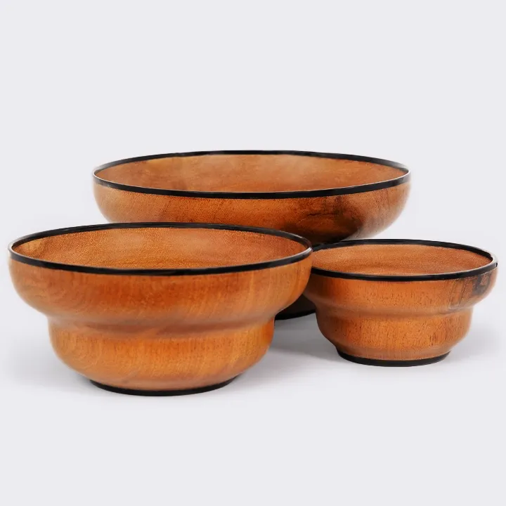 Set of three handcrafted nesting wooden bowls featuring a unique stepped profile and horn rim.