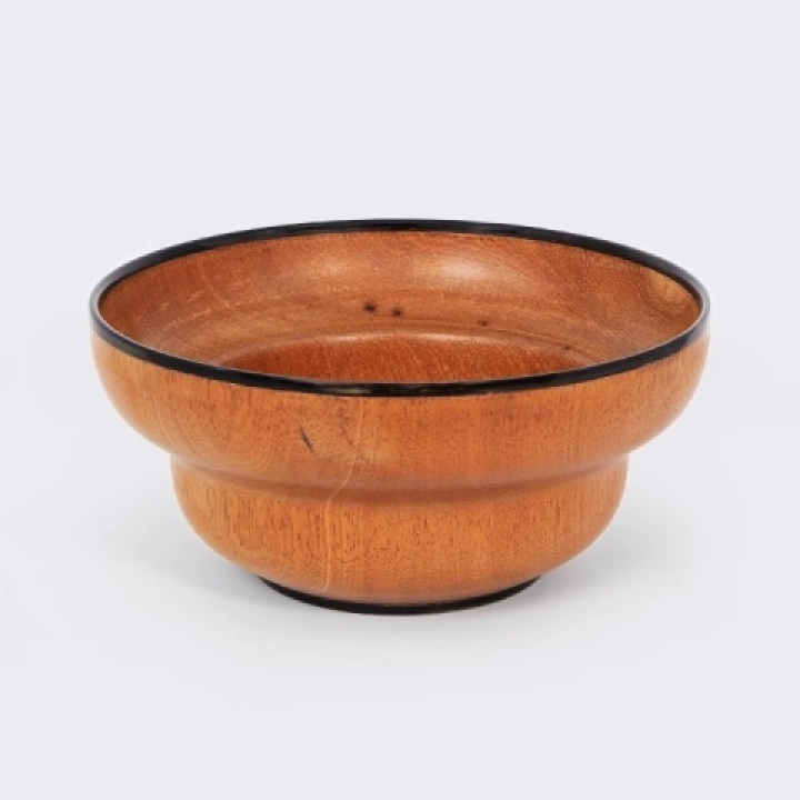 Handcrafted mendoravy wooden bowl from Madagascar with a double-structured rim and black horn trim.