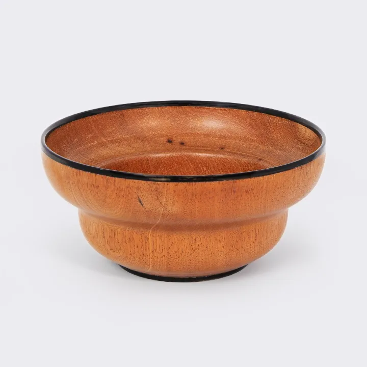 Handcrafted mendoravy wooden bowl from Madagascar with a double-structured rim and black horn trim.