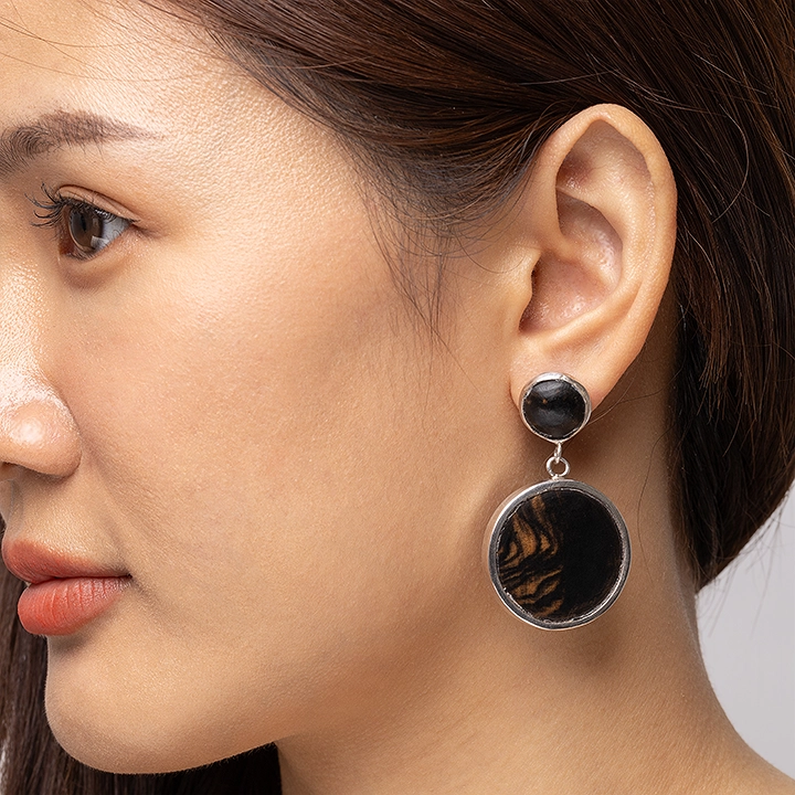 Wooden earring in use