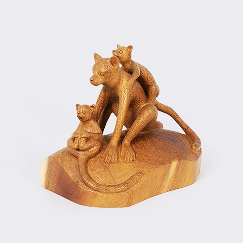 Handcrafted artisan wooden statue of a lemur family with a smooth finish.