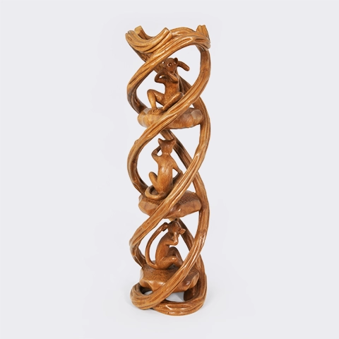 Intricate vertical wood carving featuring the Three Wise Monkeys motif interlaced with a spiral vine, handcrafted from solid exotic wood