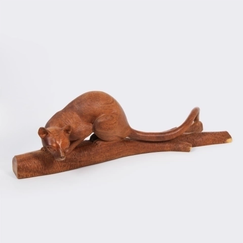 Handcrafted exotic wood sculpture of a stalking Fossa, a rare collectible wildlife art piece made in Madagascar.