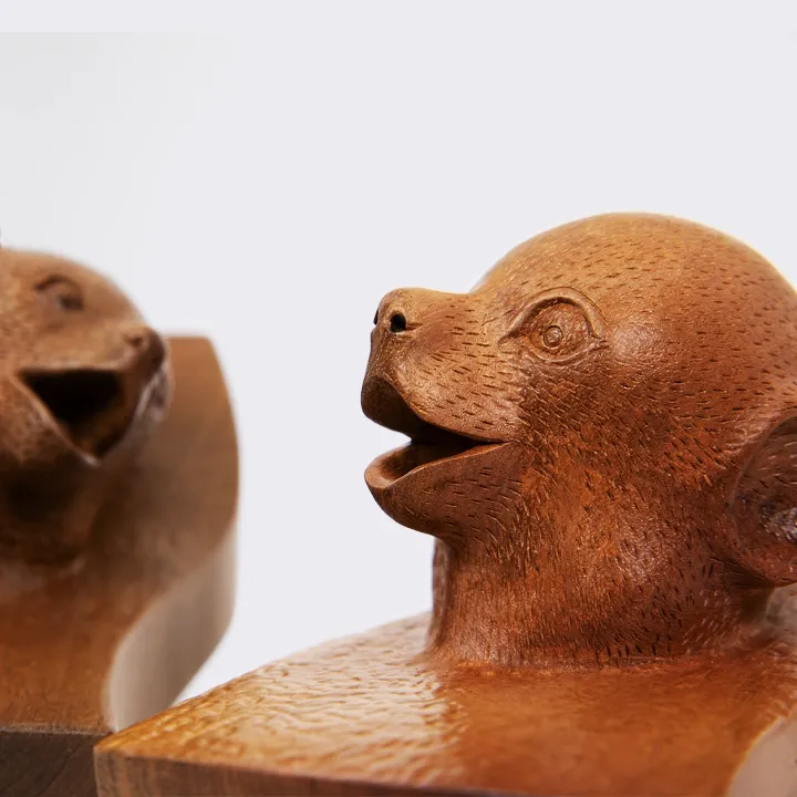 Set of three Maki head sculptures with different expressions, made in Madagascar.