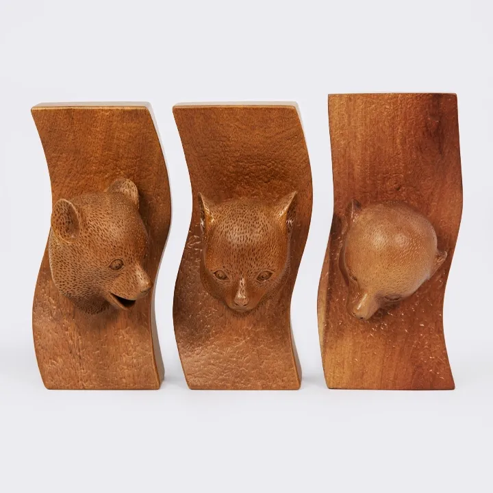 Set of three Maki head sculptures with different expressions, made in Madagascar.