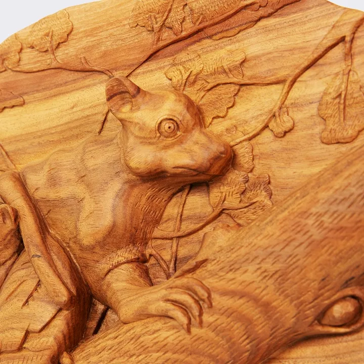 Fine art wooden carved pannels depicting a Maki (Lemur) family on a tree branch, handcrafted from exotic wood in Madagascar