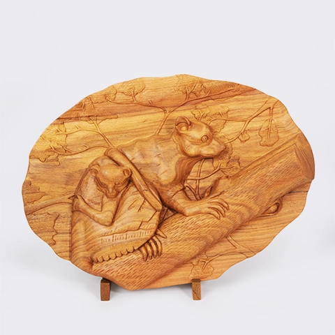 Fine art wooden carved pannels depicting a Maki (Lemur) family on a tree branch, handcrafted from exotic wood in Madagascar