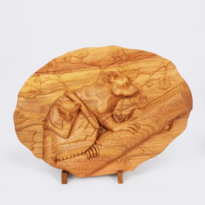 Fine art wooden carved pannels depicting a Maki (Lemur) family on a tree branch, handcrafted from exotic wood in Madagascar