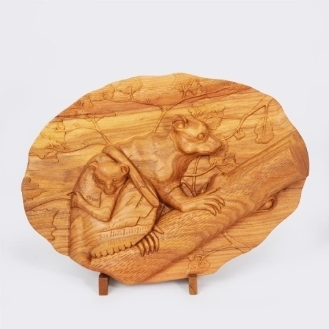 Fine art wooden carved pannels depicting a Maki (Lemur) family on a tree branch, handcrafted from exotic wood in Madagascar