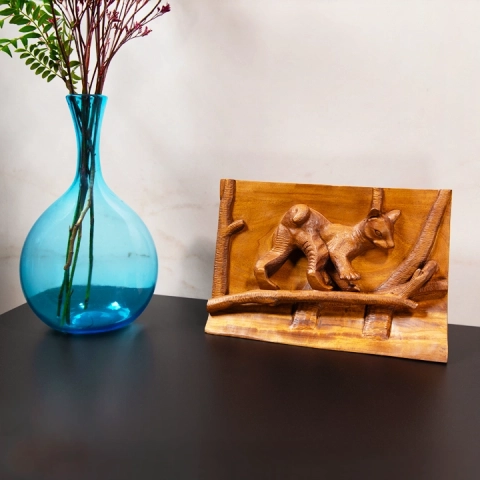 Elegant nature-inspired interior decoration: a raised wooden plaque depicting a baby fossa