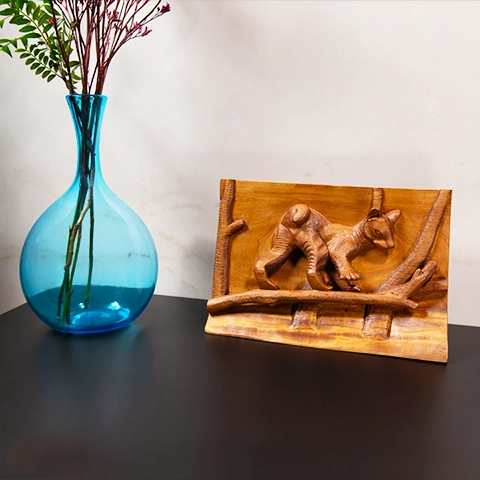 Elegant nature-inspired interior decoration: a raised wooden plaque depicting a baby fossa