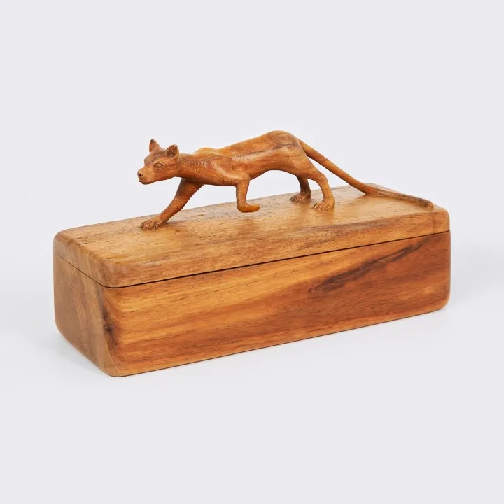Handcrafted decorative wooden box adorned with a carved Madagascar fossa on the lid.