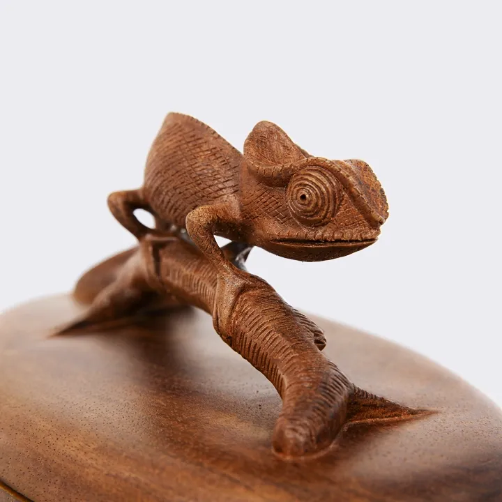 Hand-carved oval decorative box made of precious wood, featuring a detailed Madagascar Chameleon sculpture as the lid handle.