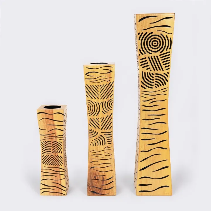 Single modern artisan wooden candle holder with abstract black line art design.