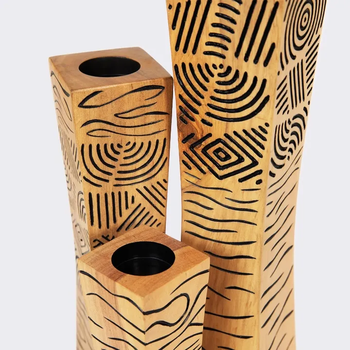 Single modern artisan wooden candle holder with abstract black line art design.