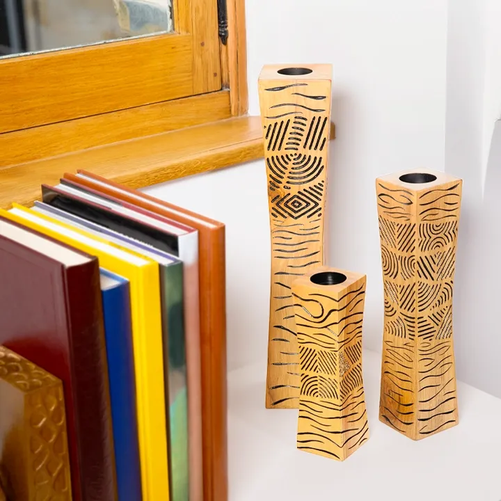 Single modern artisan wooden candle holder with abstract black line art design.