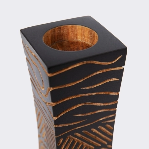 Close-up of the candlestick, showing the hand-carved abstract line art design, highlighting the craftsmanship and perfection of the sculpture
