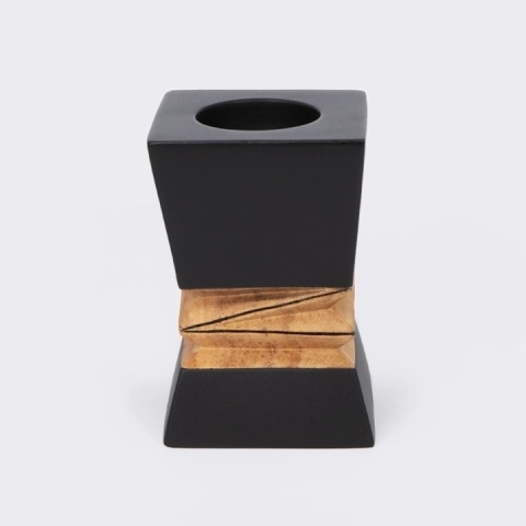 Handcrafted modern candle holder featuring a black top and bottom with a central geometric natural wood carving