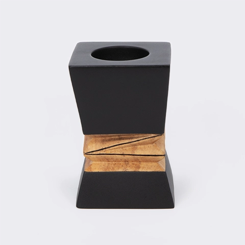 Handcrafted modern candle holder featuring a black top and bottom with a central geometric natural wood carving