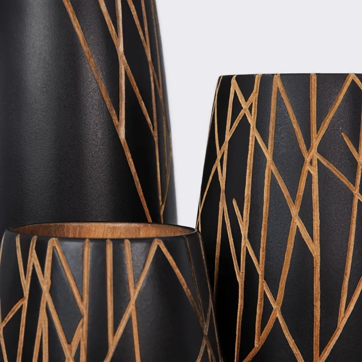 An elegant, handcrafted black wooden vase