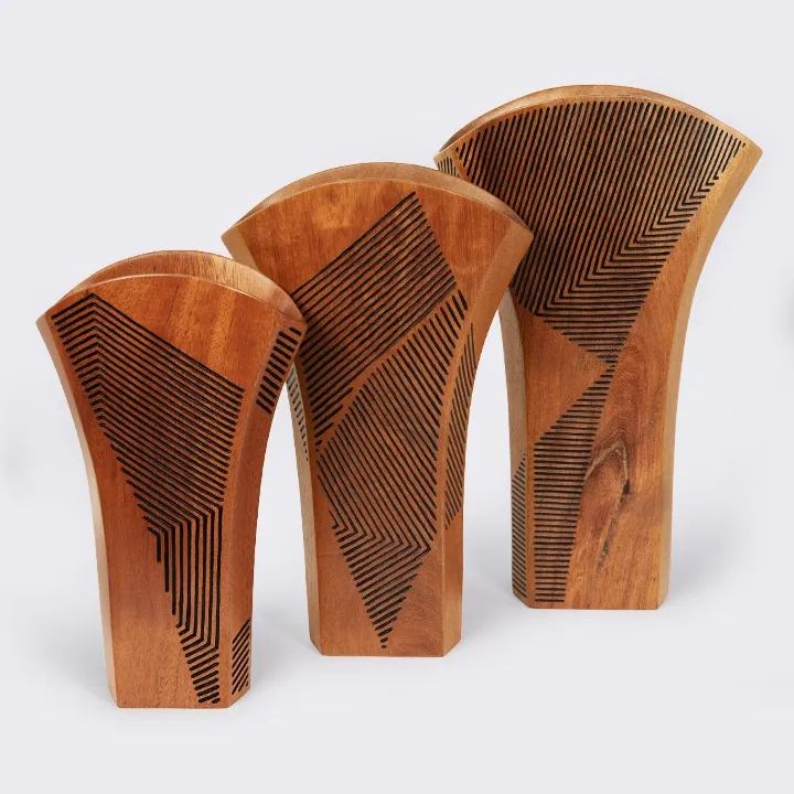Set of three handcrafted flared wooden vases in graduated sizes, featuring a modern geometric chevron engraving design