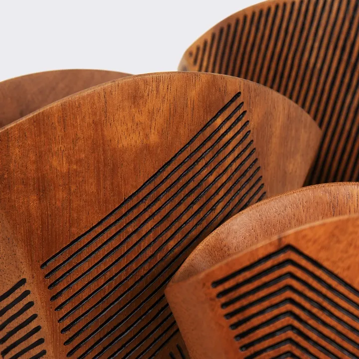 Single handcrafted wood vase with a flared rim and intricate black linear geometric engravings, artisan design from Madagascar.