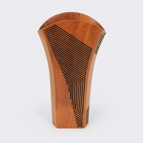 Single handcrafted wood vase with a flared rim and intricate black linear geometric engravings, artisan design from Madagascar.