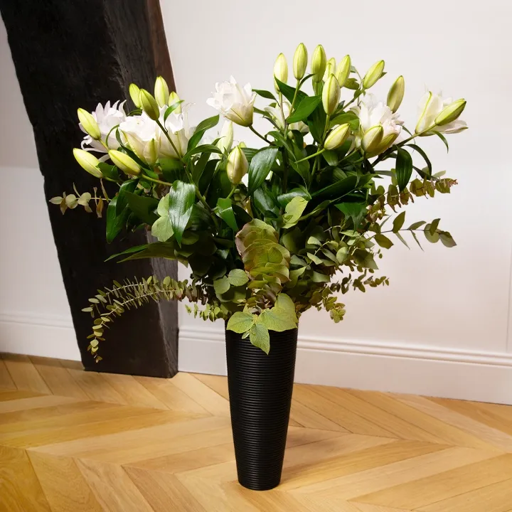 Conical wooden vase, handcrafted, with a matte black finish and sculpted horizontal ribs.