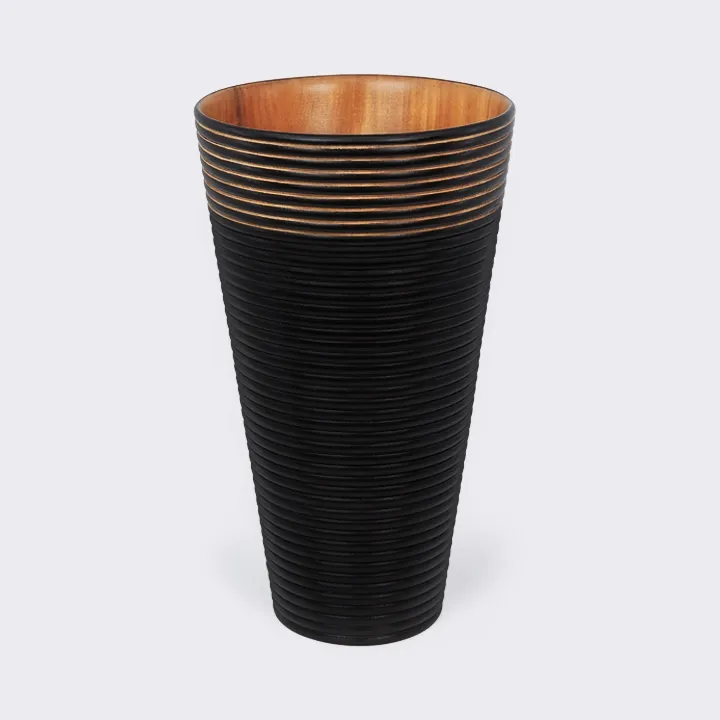 Conical wooden vase, handcrafted, with a matte black finish and sculpted horizontal ribs.