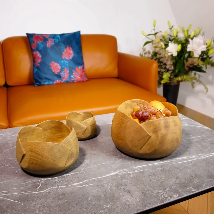 Rotating view of the Handcrafted sohihy wood bowl with a sculptural flower design, artisan made in Madagascar.