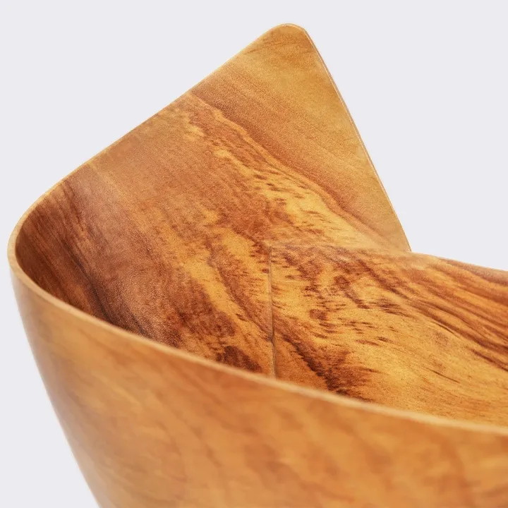 Rotating view of the Handcrafted Sohihy wooden bowl with a unique asymmetrical folded shape, inspired by modern skyscraper architecture.