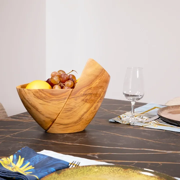 Rotating view of the Handcrafted Sohihy wooden bowl with a unique asymmetrical folded shape, inspired by modern skyscraper architecture.