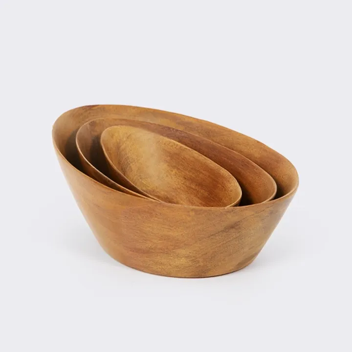 Rotating view of the set of three oval nesting bowls, handcrafted from sohihy wood with a natural finish. 