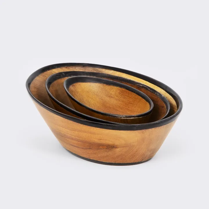 Rotating view of the Set of three nesting oval exotic wood bowls with a sleek modern design and black painted rim.