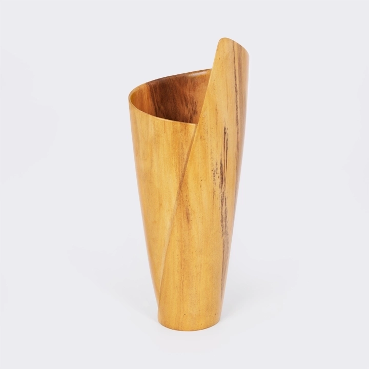 Handcrafted tall wooden vase with a sculptural, asymmetrical rim on a white background.