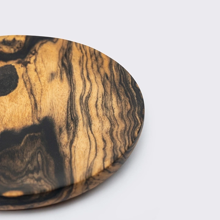 Rotating view highlighting the round coaster's features.