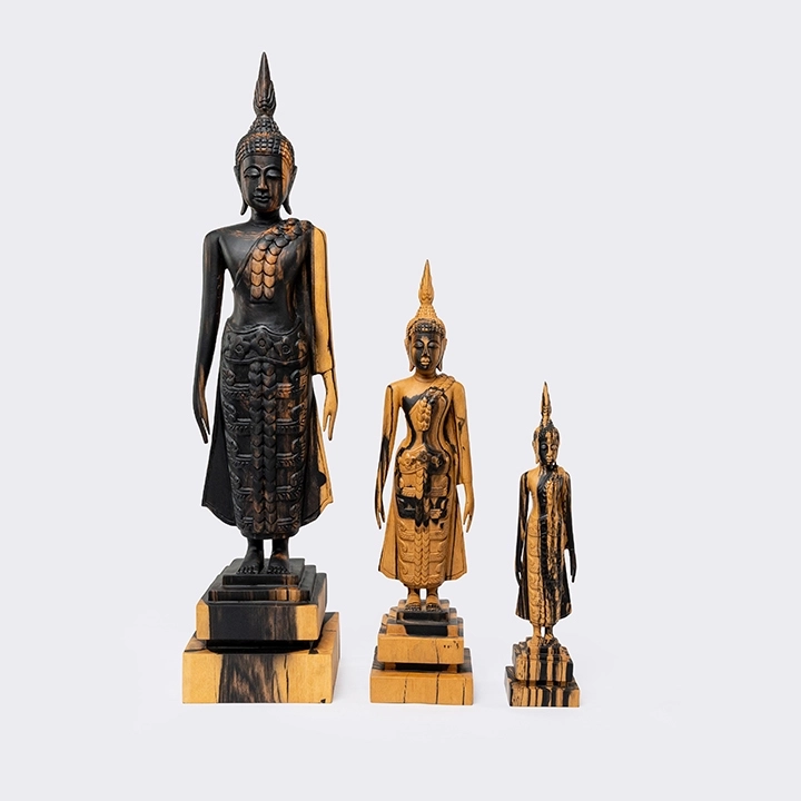 Studio shot featuring a set of buddha's sculpture
