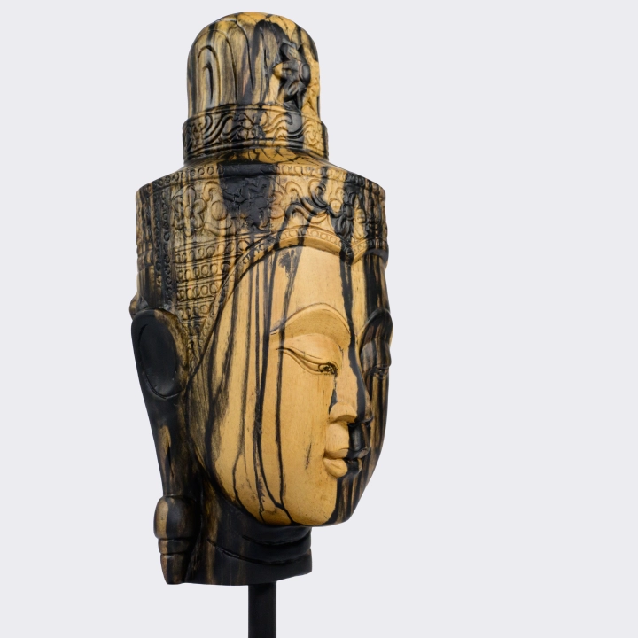 Rotating view highlighting the sculpture of Buddha's head's features.