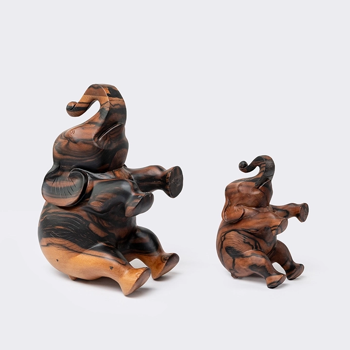 Studio shot featuring a set of Elephant sculpture.